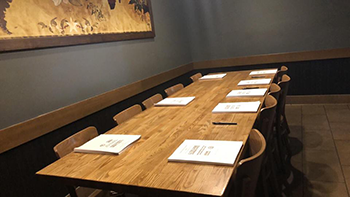 A Seat at the Table for EMS Workers in Prescott, Arizona Empty table with copies of Local 2960's final contract